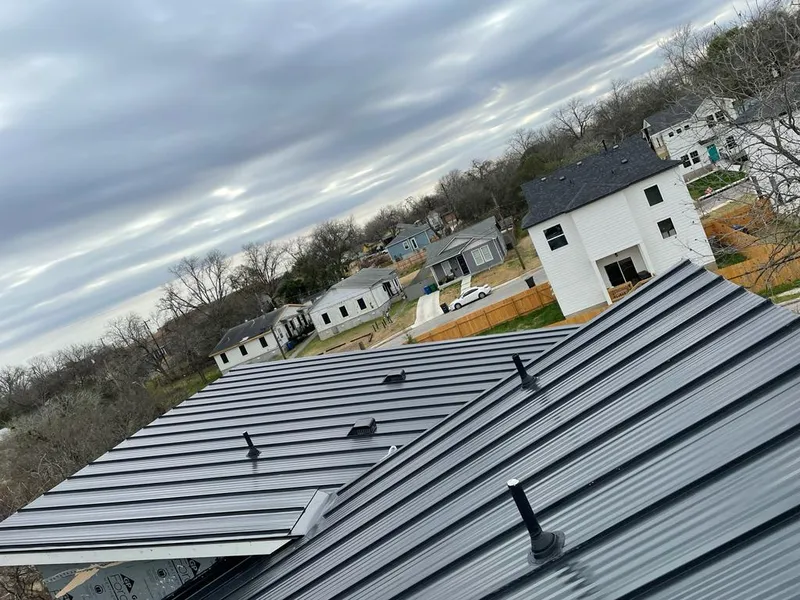 Standing seam metal roof panels with vents for Skylight Repair in Beacon Falls